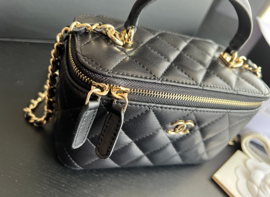 CHANEL Black Quilted Vanity Mini Crossbody with Gold
Hardware