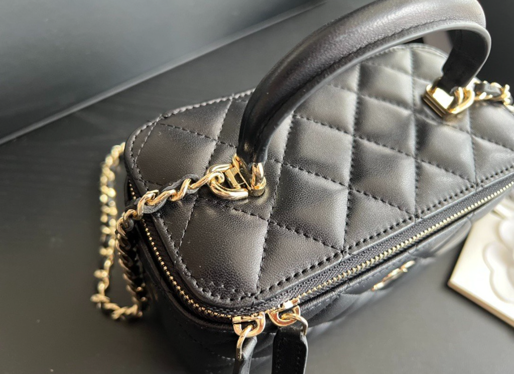 CHANEL Black Quilted Vanity Mini Crossbody with Gold
Hardware